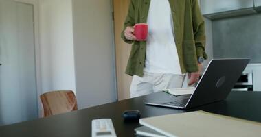 A man standing in front of a laptop computer video