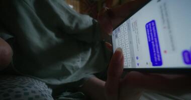 A person is using a cell phone with text messages on it video