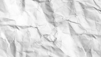 Crinkled paper texture This close-up captures the intricate textures of a piece of crinkled paper, offering a visual interplay of light and shadow, revealing a story of its own. video