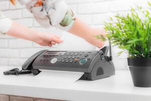 Fax machine close up in an office photo
