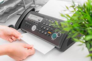 Fax machine close up in an office photo