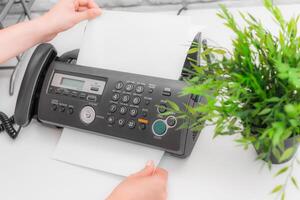 Fax machine close up in an office photo