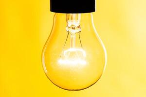 Close up of an illuminated light bulb photo