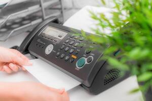 Fax machine close up in an office photo