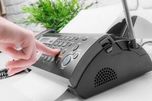 Fax machine close up in an office photo