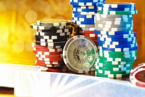 Poker chips stacks on bokeh light background photo