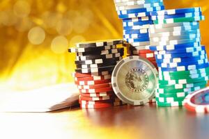 Poker chips stacks on bokeh light background photo