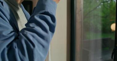 A man is looking out the window video