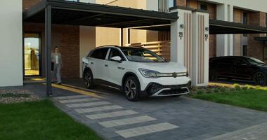 A white car parked in front of a house video