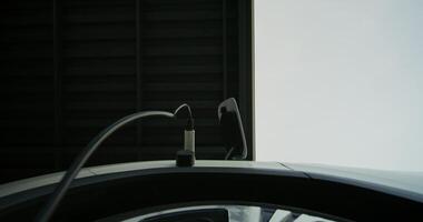 A close up of a car with a cable attached to it video