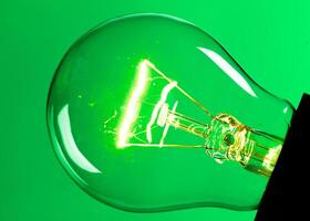 Close up of an illuminated light bulb photo