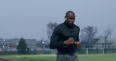 A man running on a soccer field video