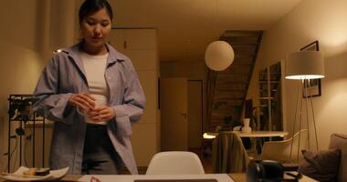 A woman standing in front of a table with food video