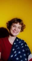 A woman is smiling while holding an american flag video