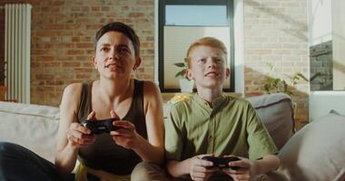 A woman and a boy playing games video