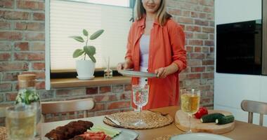 A woman standing in front of a table with food video