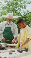 A man and a boy working on a project video