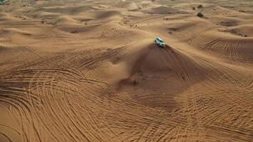 A car is driving through the desert in the middle of the desert video