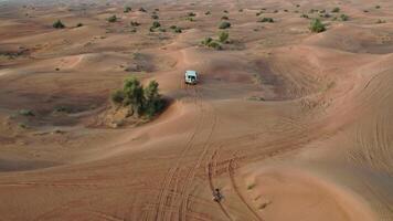 A truck is driving through the desert in the middle of the desert video