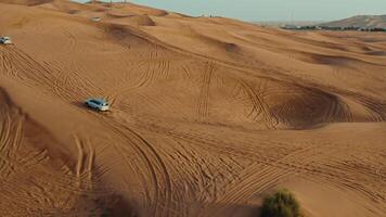 A vehicle is driving through the desert in the middle of the desert video