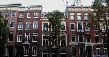 A row of buildings with windows and balconies video
