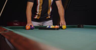 A man is playing pool with balls video