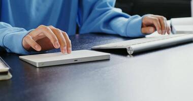 A person is typing on a keyboard and a mouse video