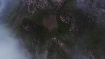 A mountain with a cloud cover and a mountain peak video