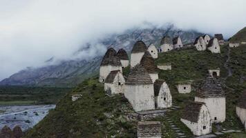 Ancient village in the mountains with a mountain range in the background video