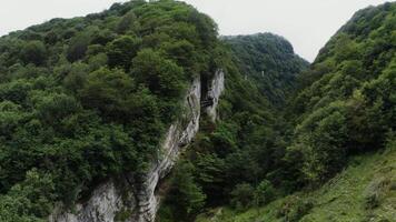 A view of a mountain with a river running through it video