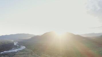 A view of the sun shining over a valley video