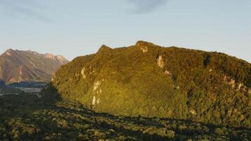 Aerial view of the mountains and forest in the background video