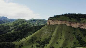A view of a mountain with a cliff on top video