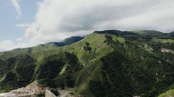 A view of a mountain range with a road on it video