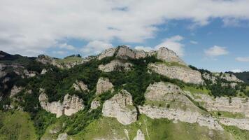 The mountain is very tall and has many rocks video