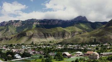A town in the mountains with a mountain range in the background video