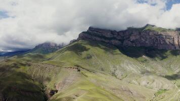 A mountain range with green and brown mountains video