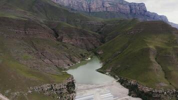 An aerial view of a river in the middle of a mountain video