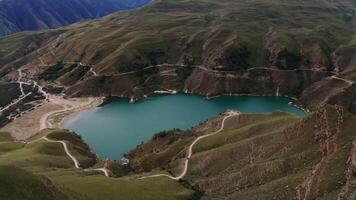 A lake in the middle of a mountain range video