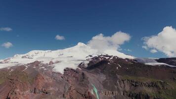 A large mountain with snow on top and clouds in the sky video