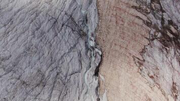 A close up of a glacier with a crack in it video
