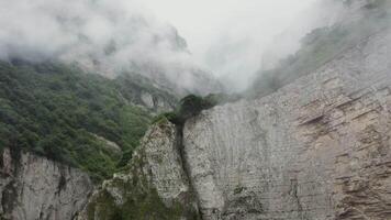 A mountain with a waterfall and a cliff video