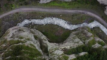 An aerial view of a river flowing through a mountain video