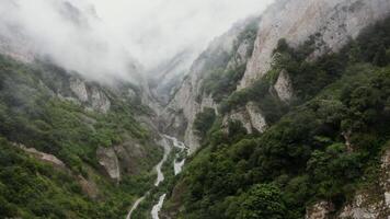 A river runs through a gorge in the mountains video