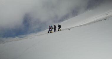 A group of people on a snowy mountain video