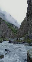 A river flowing through a rocky canyon video