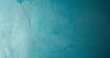 A blue and white background with a large amount of paint video