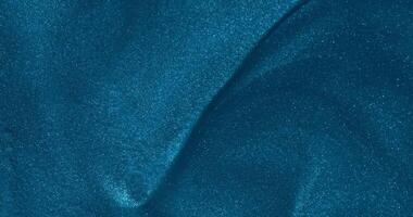 A blue colored surface with a wave pattern video