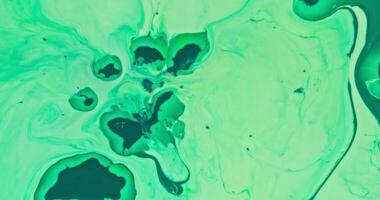 A green liquid is flowing over a surface video