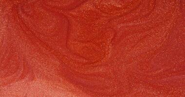 A close up of a red liquid with swirls video